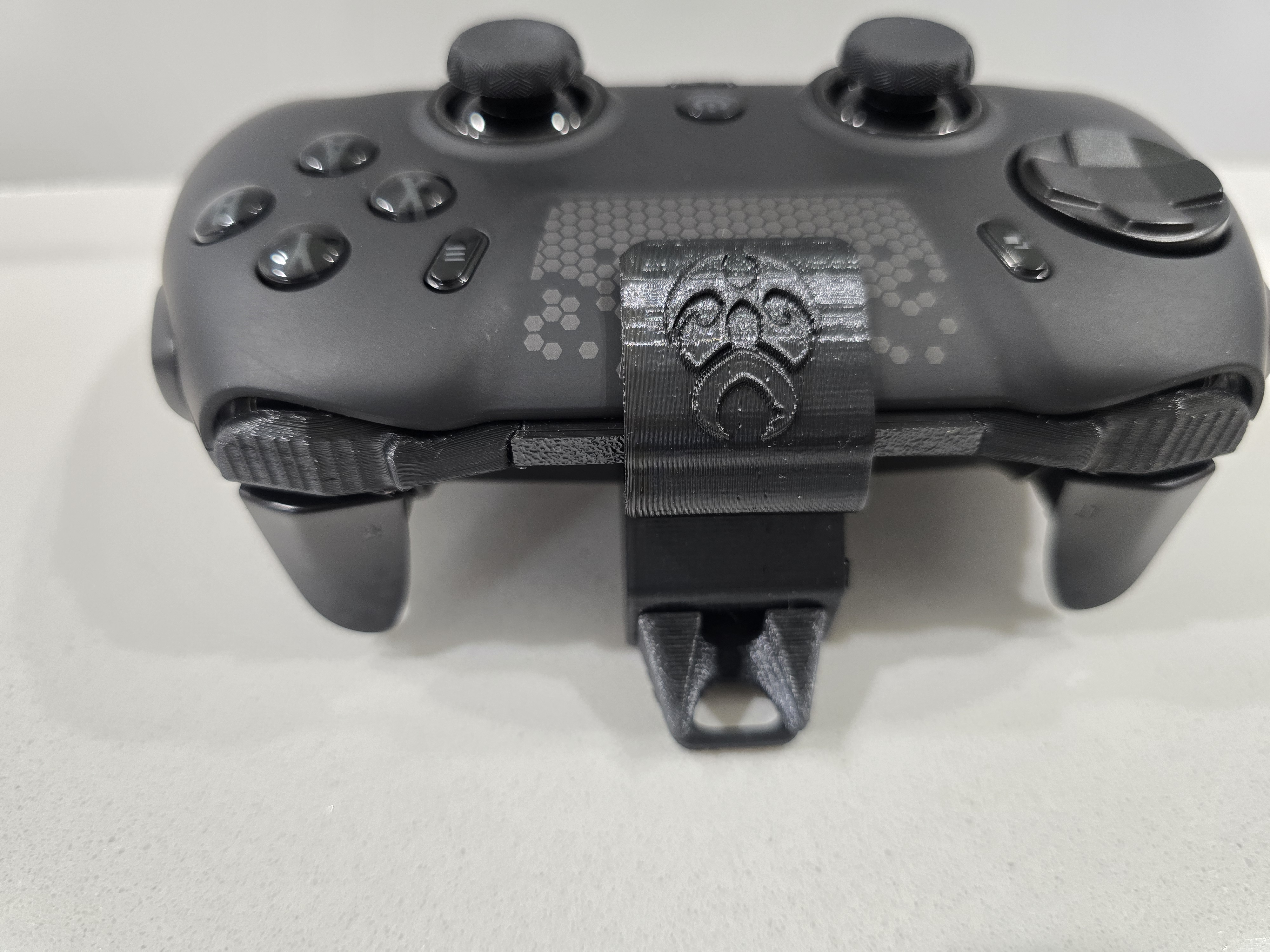 Close-up product demonstration highlighting the USB-C port protection setup on the SCUF Envision.